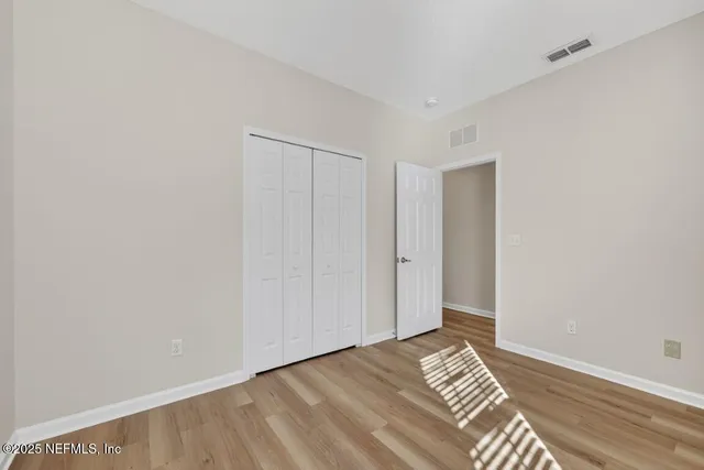 a view of a livingroom with wooden floor