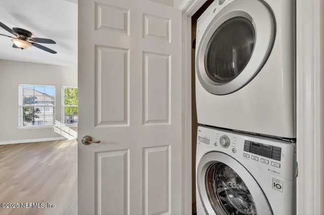 a bathroom with a granite countertop sink a toilet a mirror a bathtub and shower