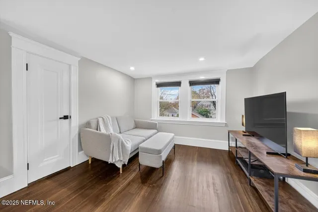 a view of a kitchen with a stove and a chandelier fan