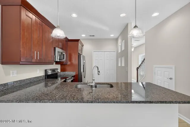 a bathroom with a sink a mirror and shower