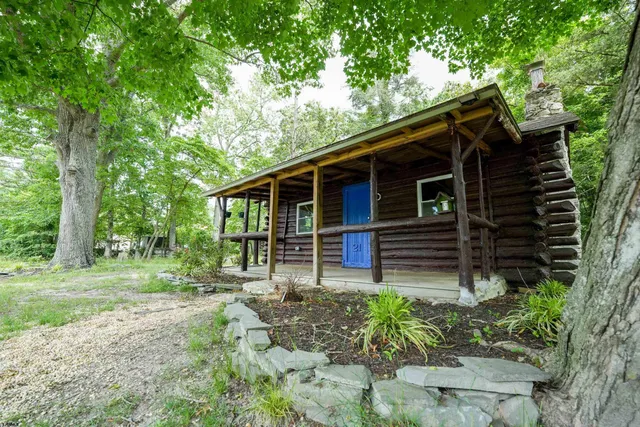 a backyard of a house with seating space