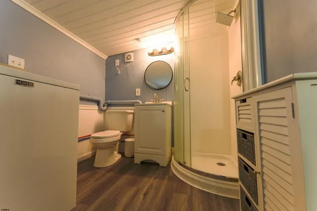 a view of front door with wooden floor