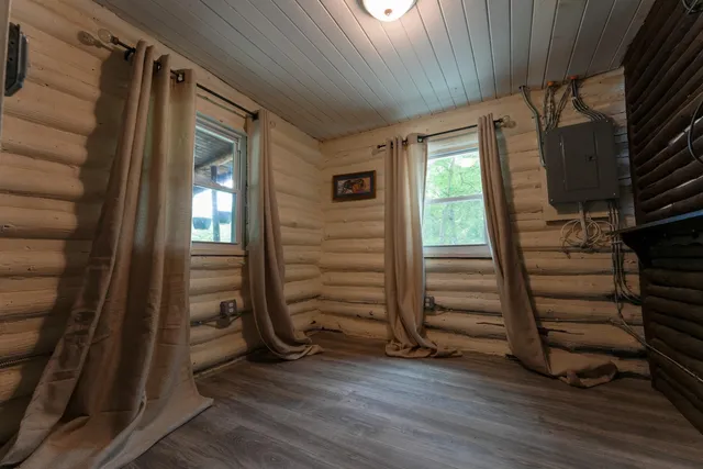 a view of a refrigerator in kitchen and wooden floor