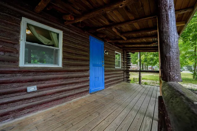 a view of porch with wooden floor and stairs