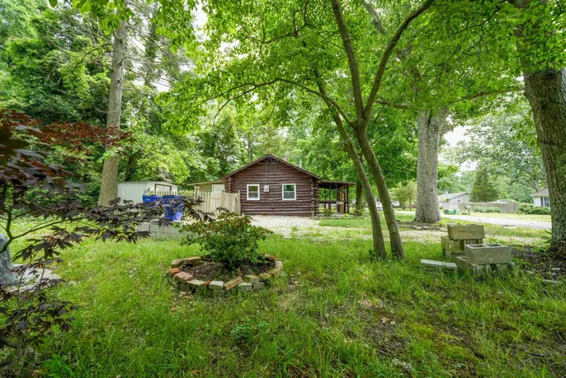 a back view of a house with a yard