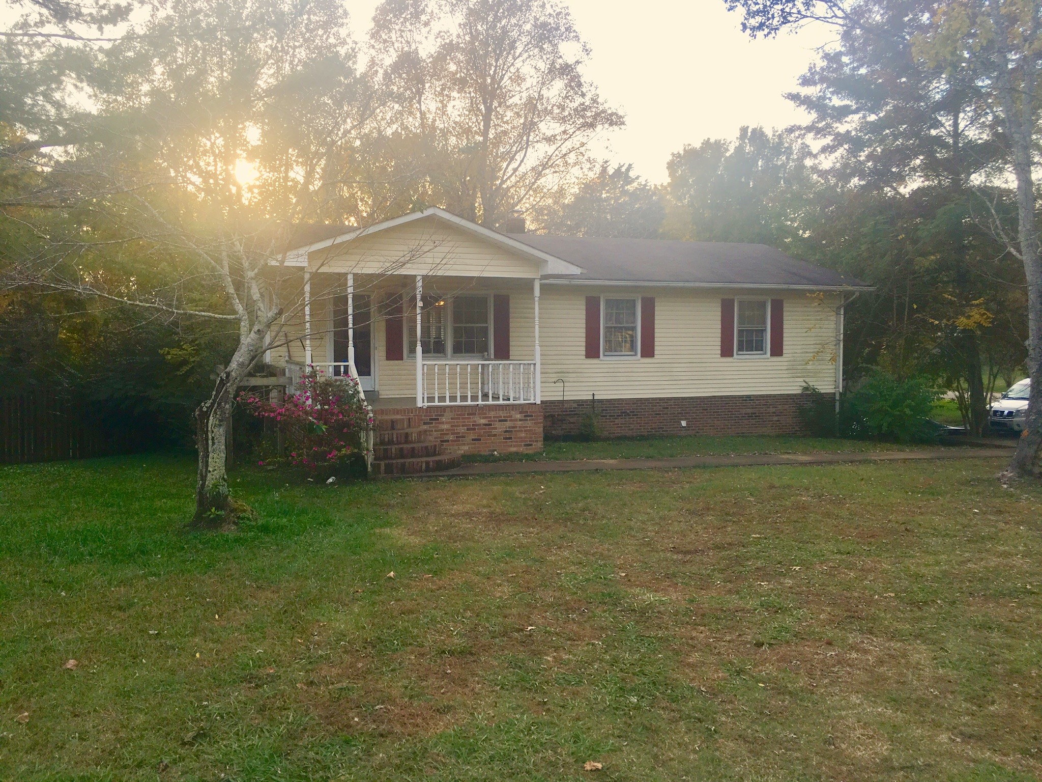 401 Prosser Road Lawrenceburg, TN 38464 - Photo 1 of 18 a front view of a house with a garden