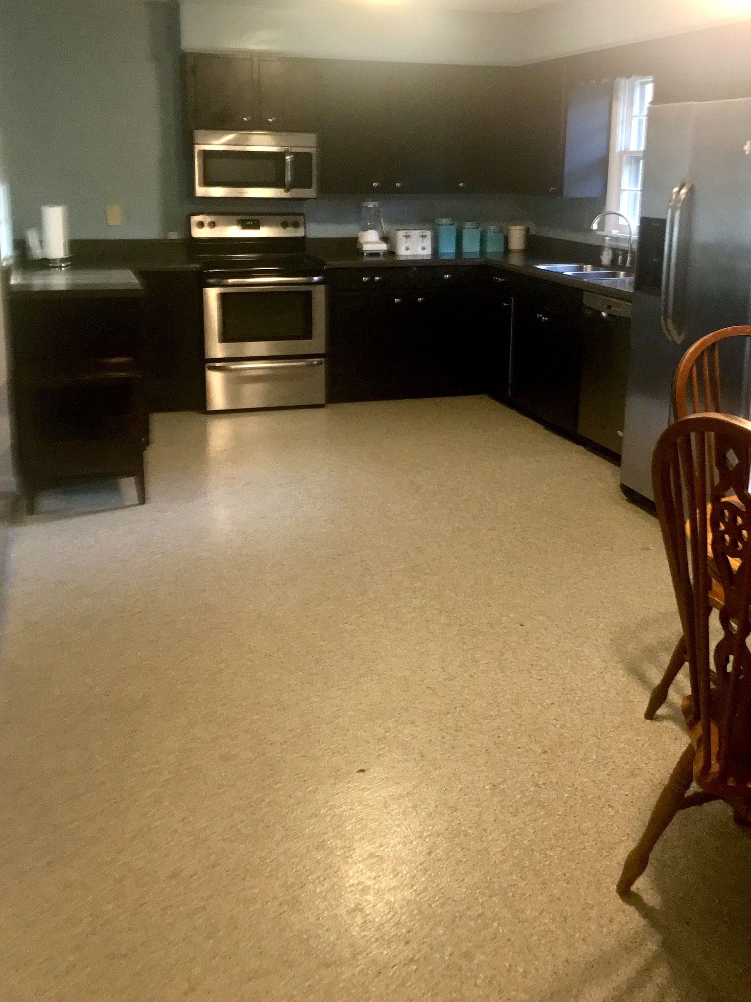 401 Prosser Road Lawrenceburg, TN 38464 - Photo 3 of 18 a kitchen with stainless steel appliances a sink a stove and a refrigerator