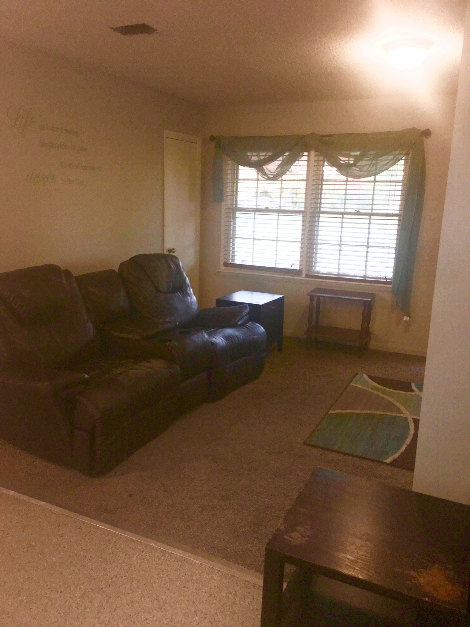 401 Prosser Road Lawrenceburg, TN 38464 - Photo 4 of 18 a living room with furniture and a flat screen tv