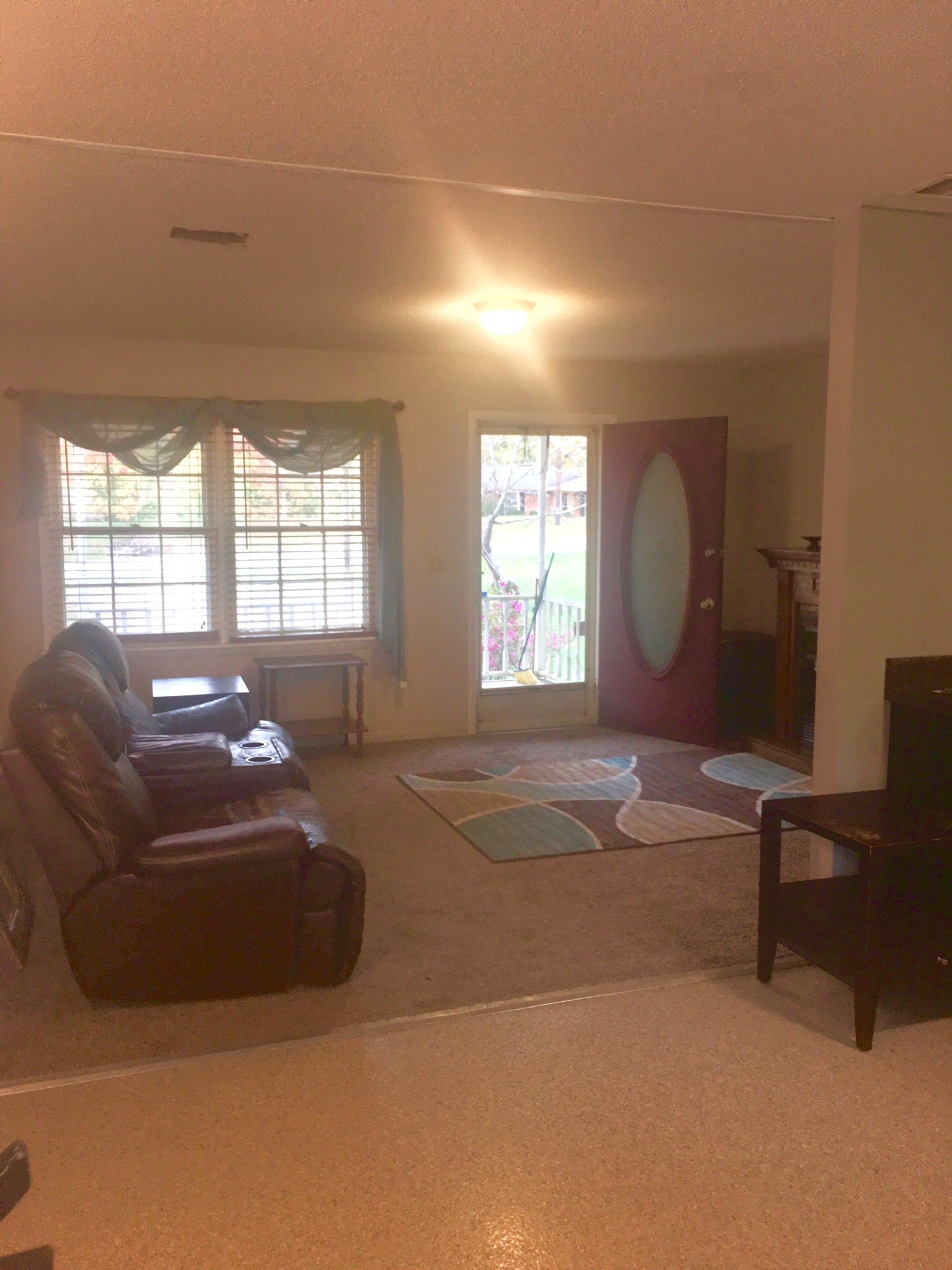 401 Prosser Road Lawrenceburg, TN 38464 - Photo 7 of 18 a living room with a couch and a large window