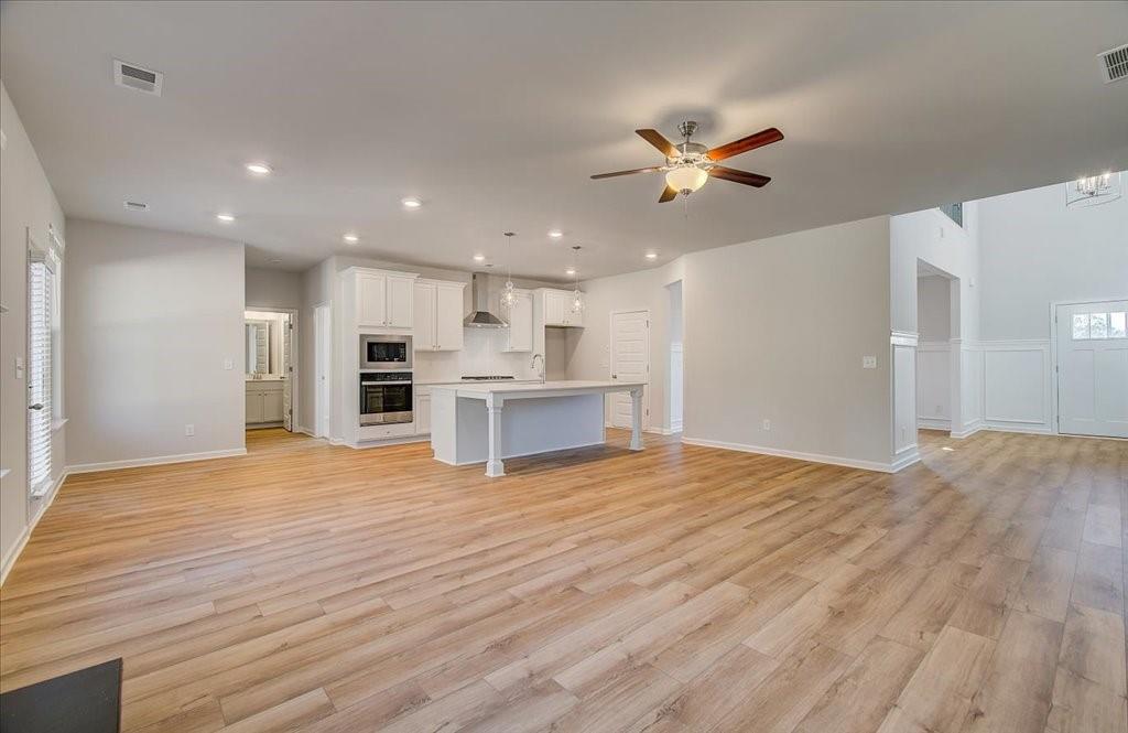 601 Button Grove Stockbridge, GA 30281 - Photo 15 of 37 a view of empty room with wooden floor and ceiling fan