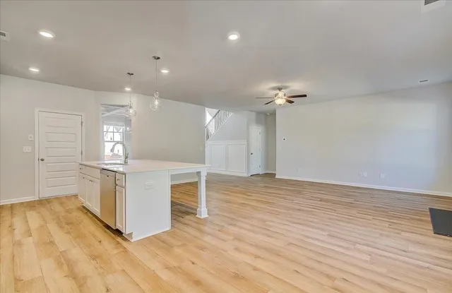 a view of kitchen with cabinets and wooden floor