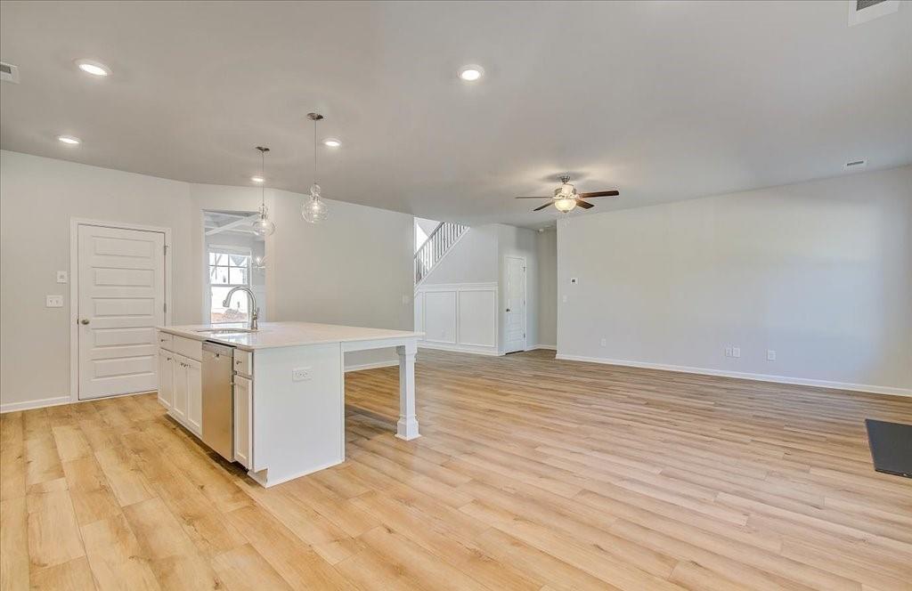 601 Button Grove Stockbridge, GA 30281 - Photo 21 of 37 a view of kitchen with cabinets and wooden floor