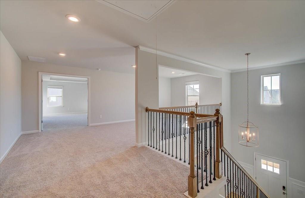 601 Button Grove Stockbridge, GA 30281 - Photo 24 of 37 a view of a hallway with entryway to stairs