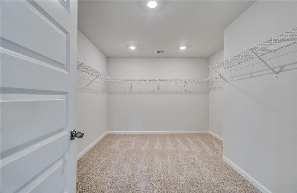 601 Button Grove Stockbridge, GA 30281 - Photo 31 of 37 a view of a room with racks on the wall