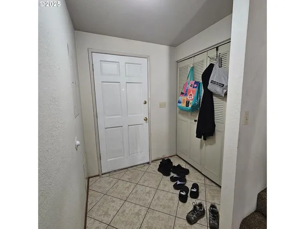 a view of yard with seating area and trees
