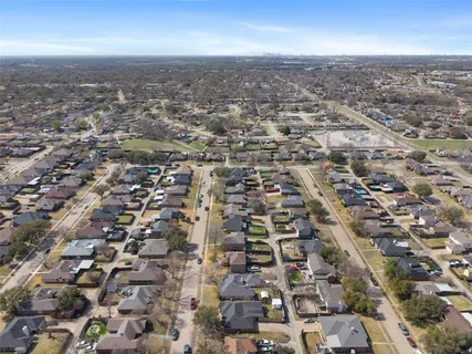an aerial view of residential building with parking space