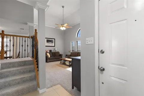 a view of a livingroom with a couch and chandelier