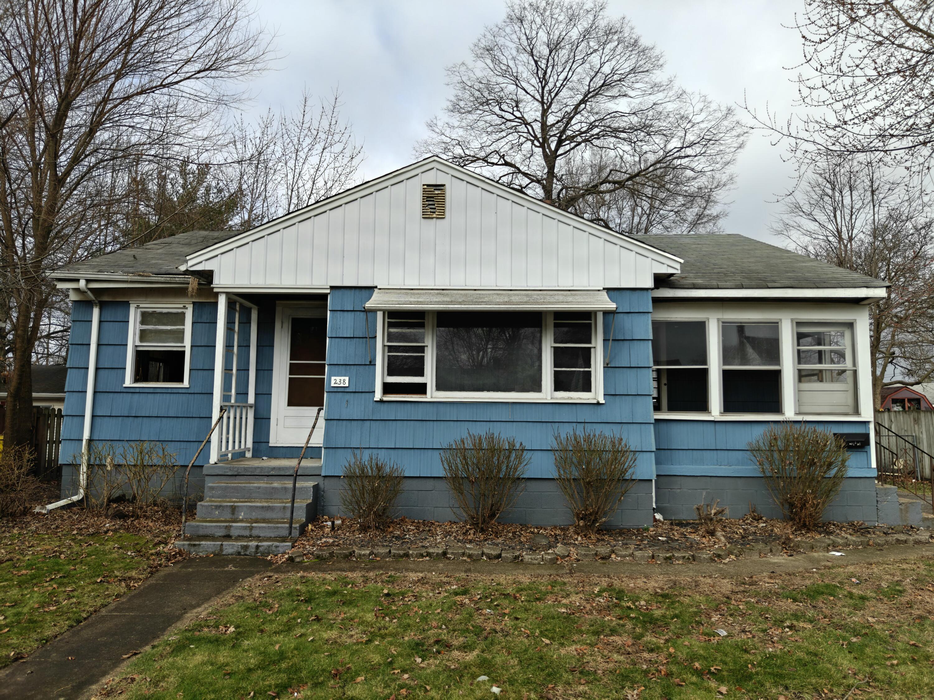 238 North Indiana Street Griffith, IN 46319 - Photo 1 of 23 a front view of a house with a yard