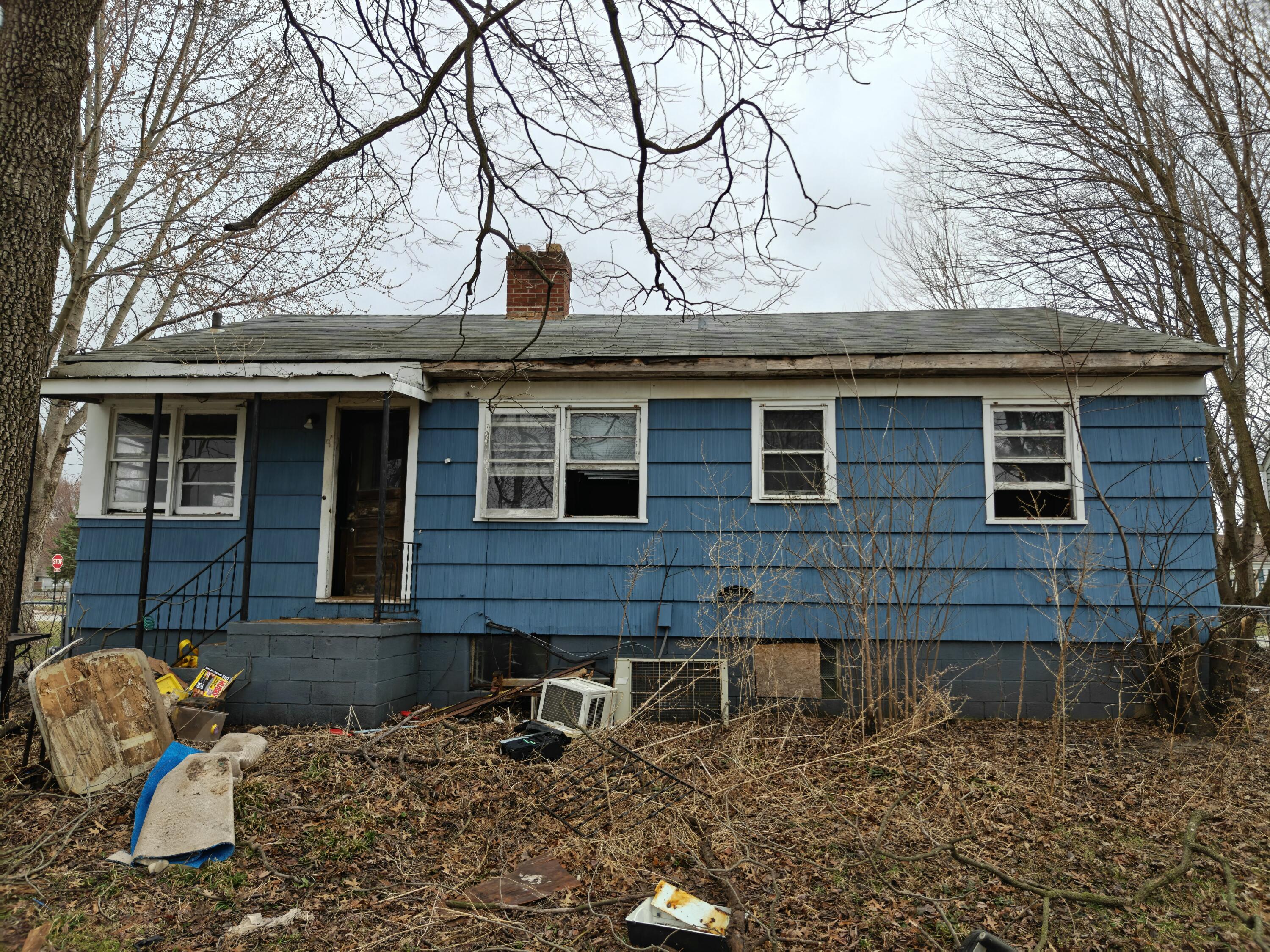 238 North Indiana Street Griffith, IN 46319 - Photo 20 of 23 a front view of a house with a yard
