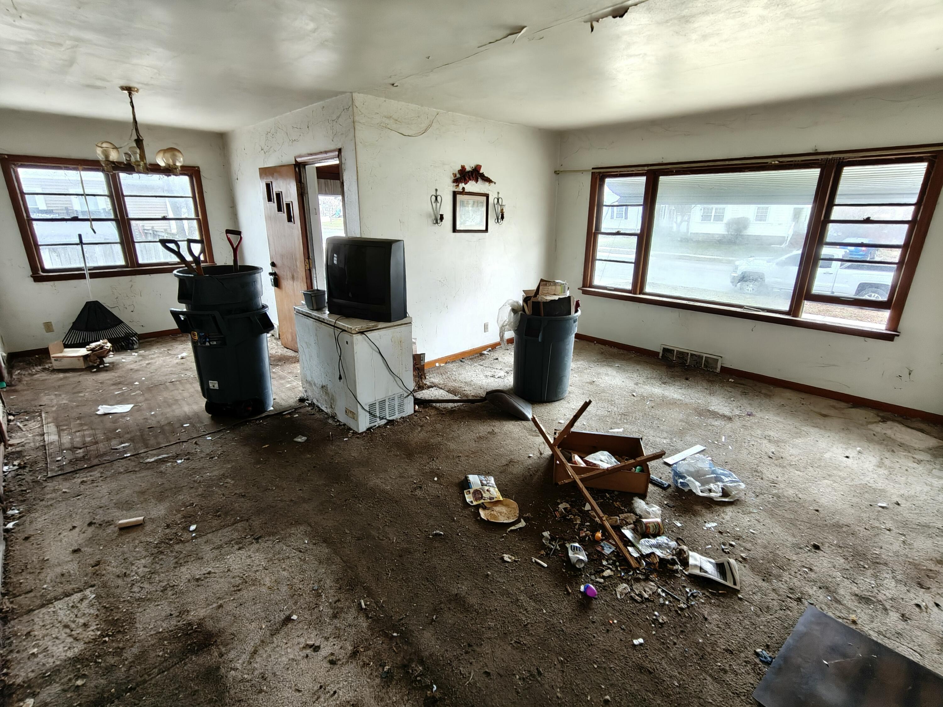 238 North Indiana Street Griffith, IN 46319 - Photo 6 of 23 a living room with furniture window and flat screen tv