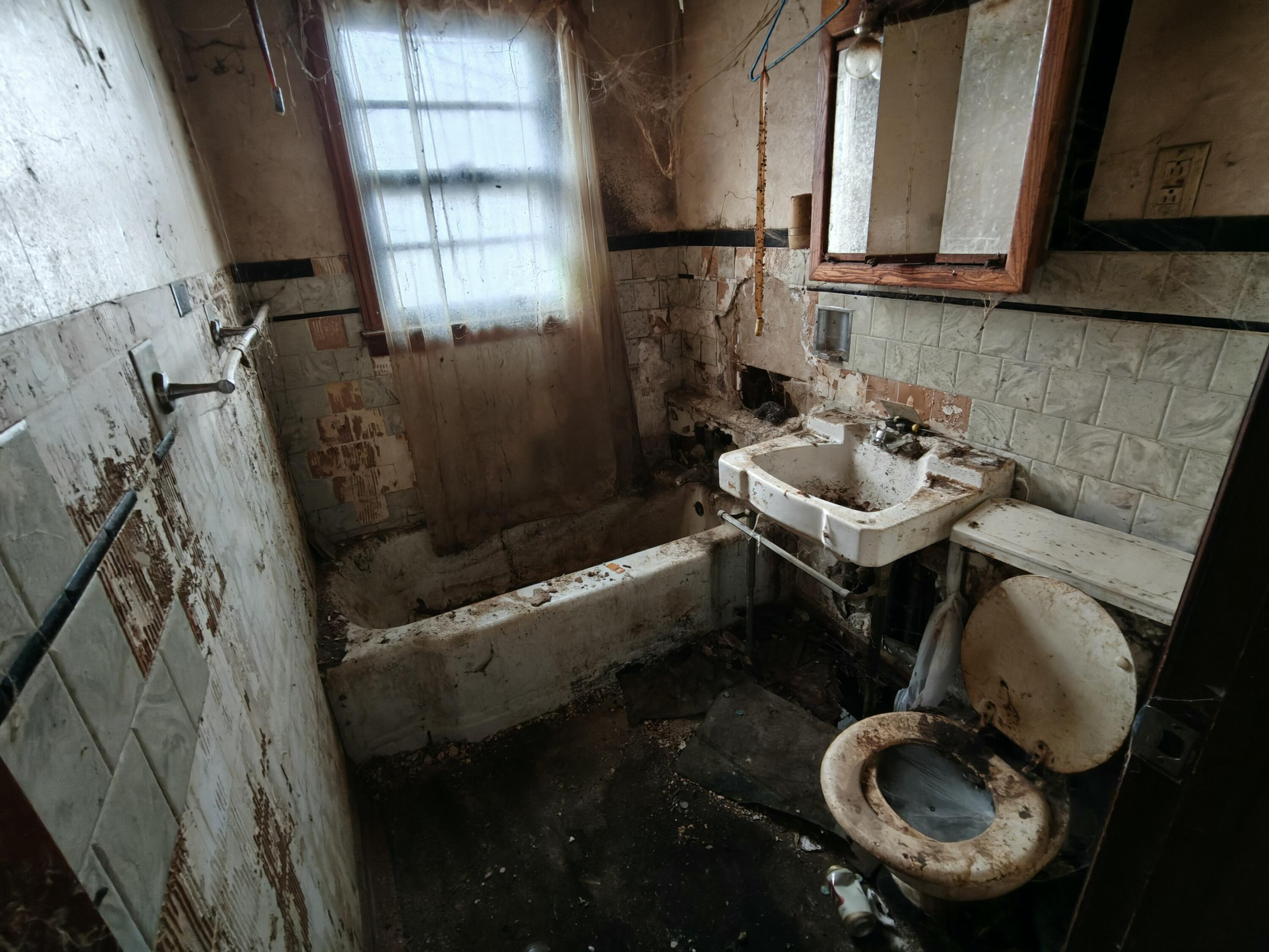 238 North Indiana Street Griffith, IN 46319 - Photo 10 of 23 a bathroom with sink toilet and mirror