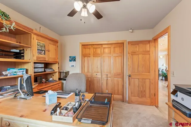 a room with furniture a flat screen tv and a window