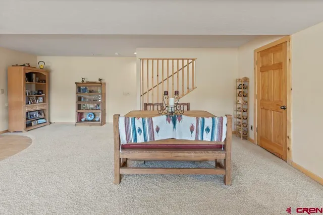 a bedroom with furniture and wooden floor