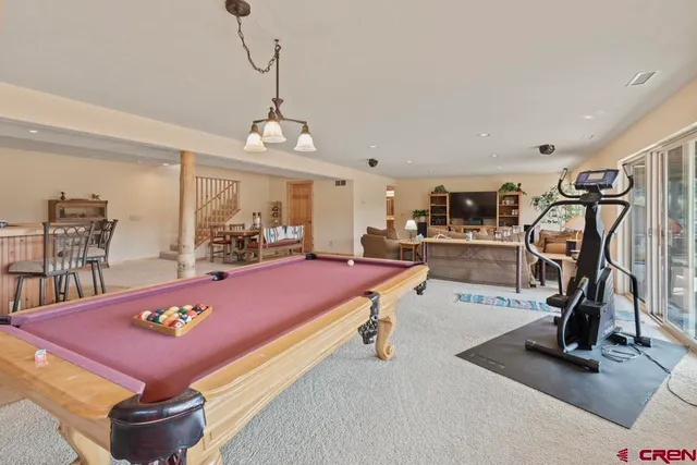 a room with lots of furniture and windows