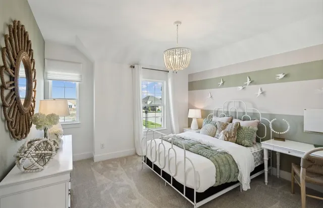 a bedroom with bed and window