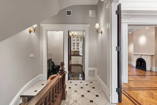 a bathroom with a toilet and mirror
