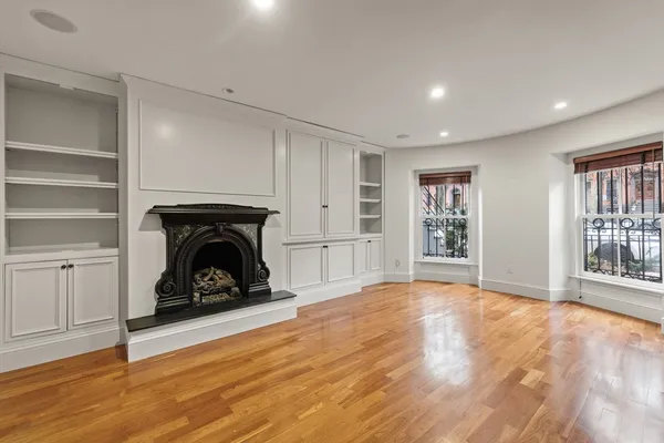 a view of a livingroom with an empty space and fire place