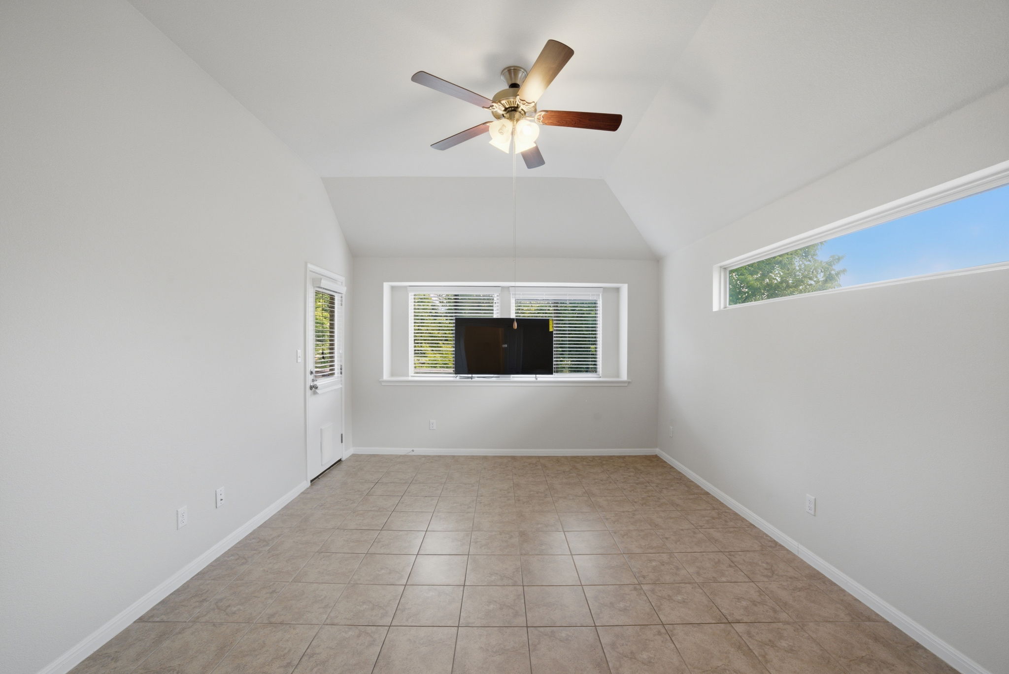 514 Nautical Loop Kyle, TX 78640 - Photo 16 of 24 A versatile living space offers elevated ceilings, tile flooring, and ample natural light.