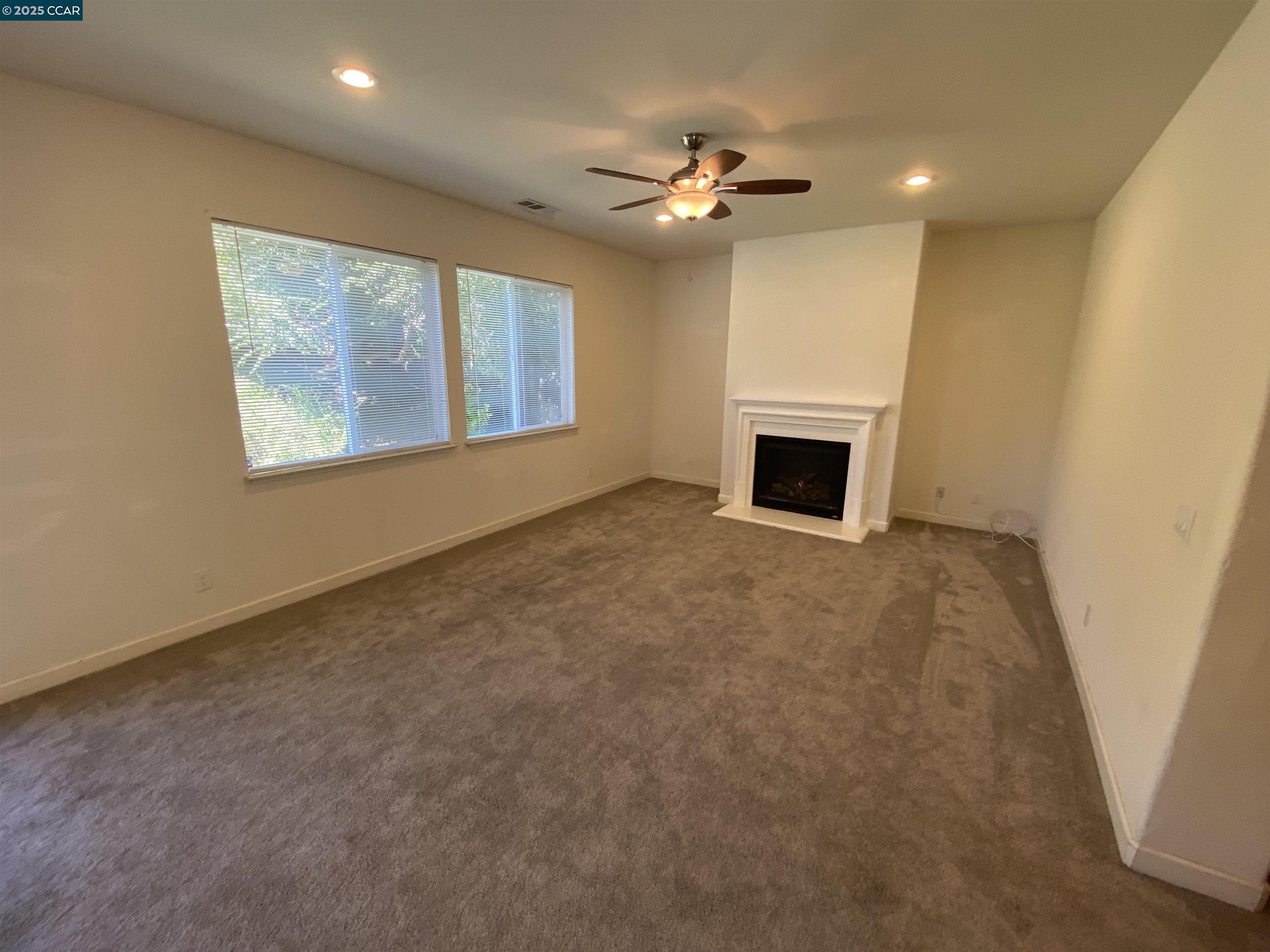 1900 La Veranda Place Martinez, CA 94553 - Photo 14 of 57 an empty room with windows and fireplace