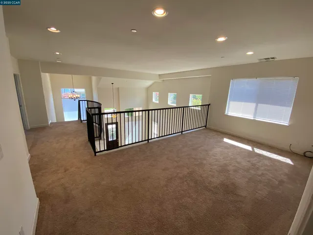a view of a kitchen with a sink and a mirror