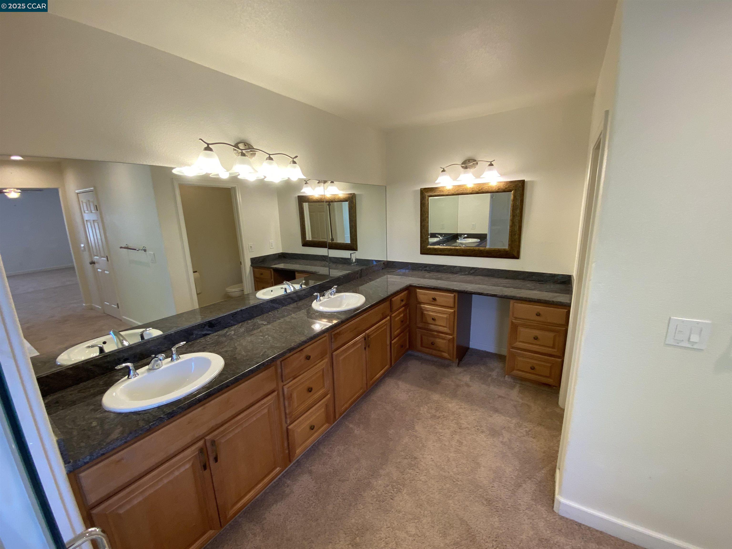 1900 La Veranda Place Martinez, CA 94553 - Photo 39 of 57 a large bathroom with a sink double vanity granite and a mirror