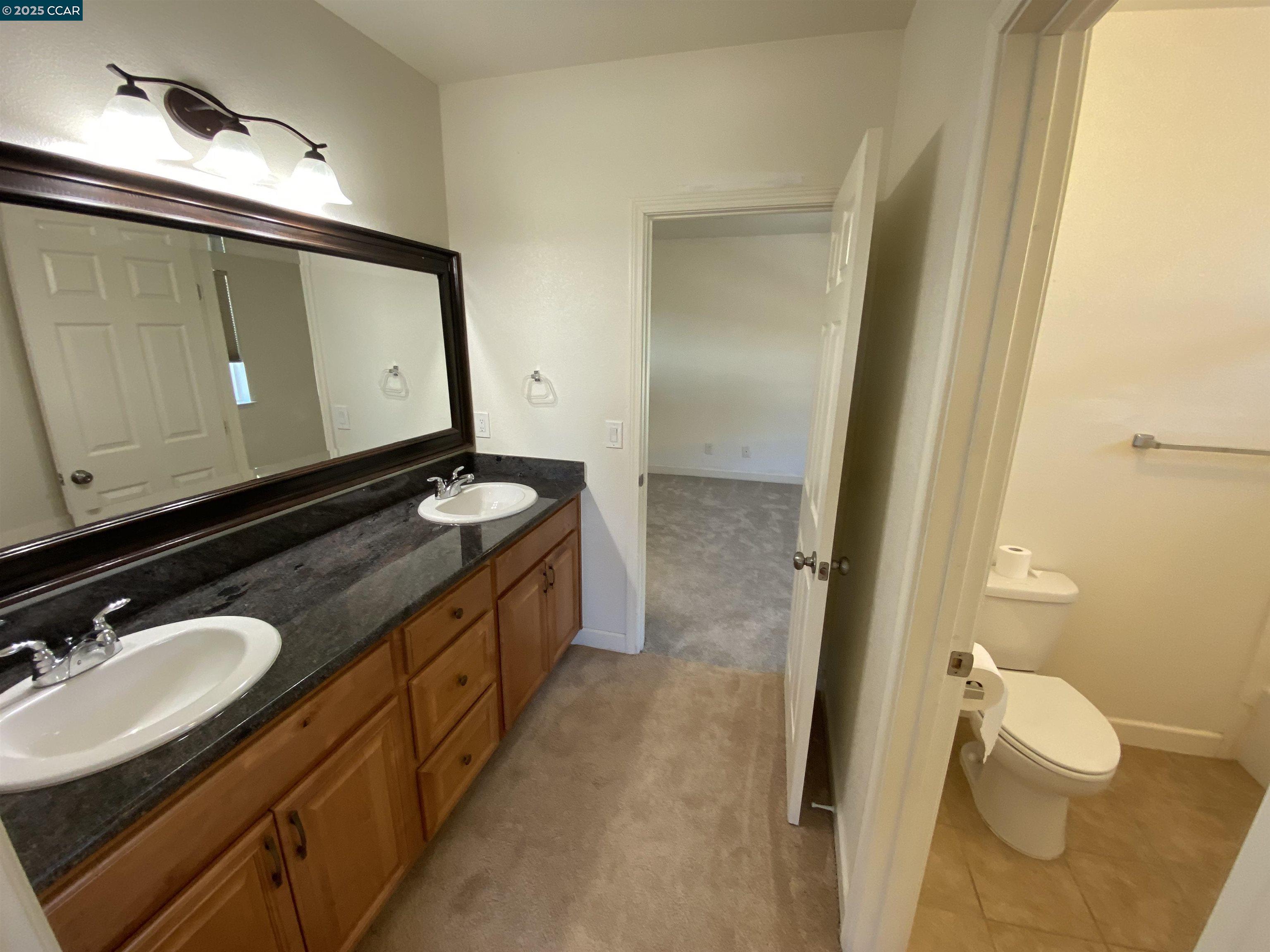 1900 La Veranda Place Martinez, CA 94553 - Photo 48 of 57 a bathroom with a granite countertop sink and a mirror