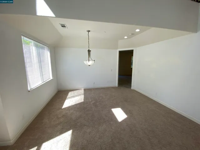a view of empty room with a window