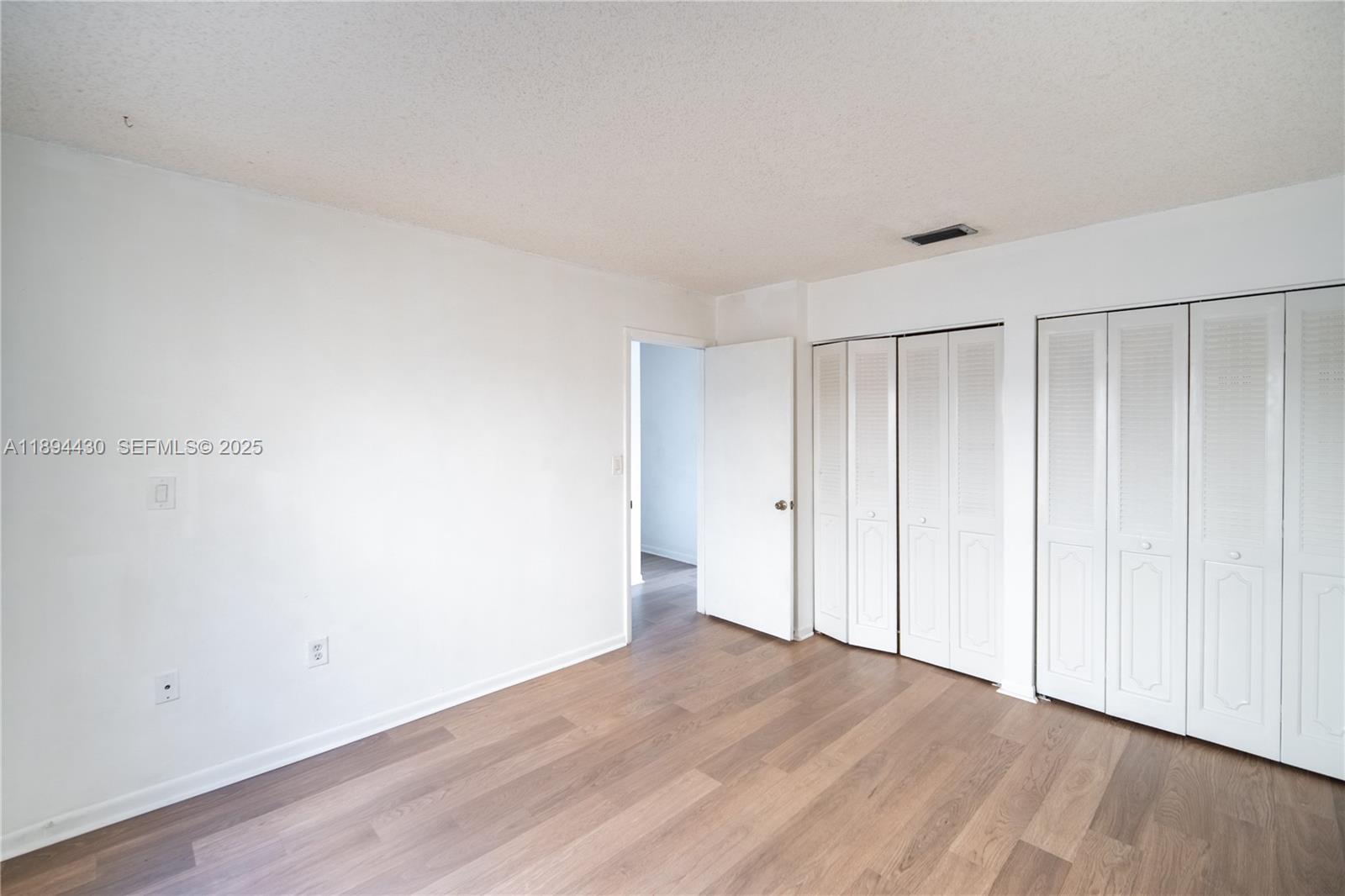 6845 Northwest 169th Street, Unit 41C Hialeah, FL 33015 - Photo 12 of 20 a view of an empty room