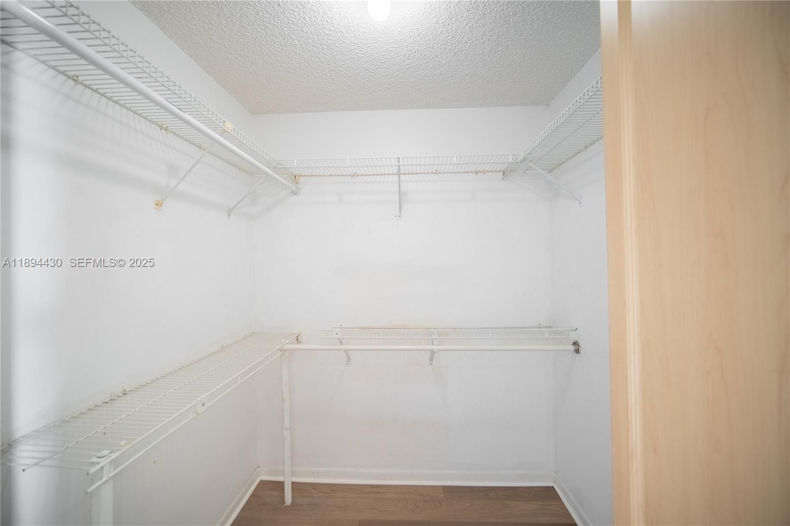 6845 Northwest 169th Street, Unit 41C Hialeah, FL 33015 - Photo 19 of 20 a view of a room with racks on the wall