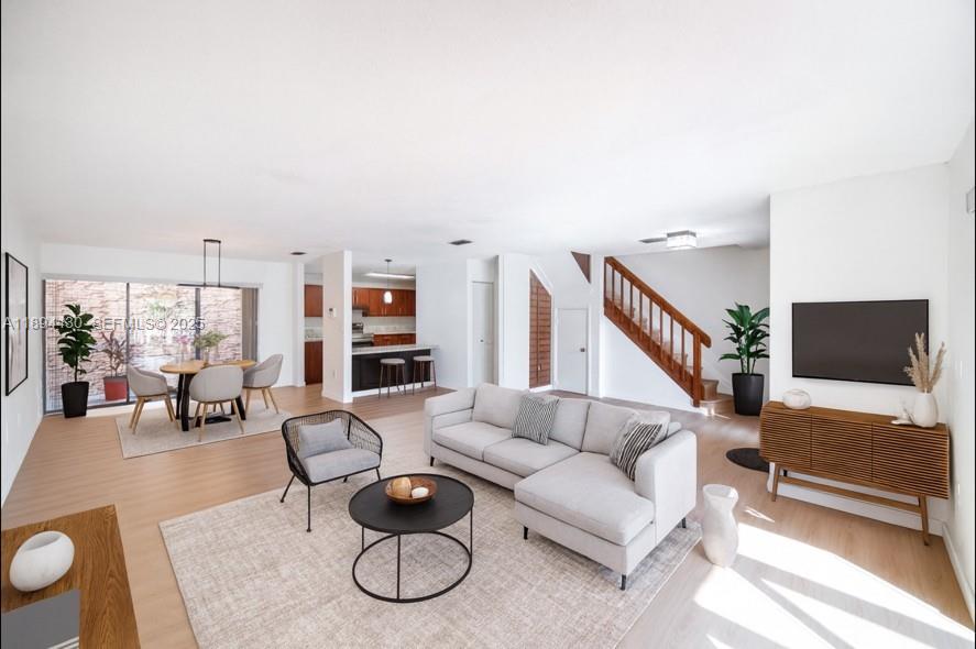 6845 Northwest 169th Street, Unit 41C Hialeah, FL 33015 - Photo 2 of 20 a living room with furniture and a flat screen tv