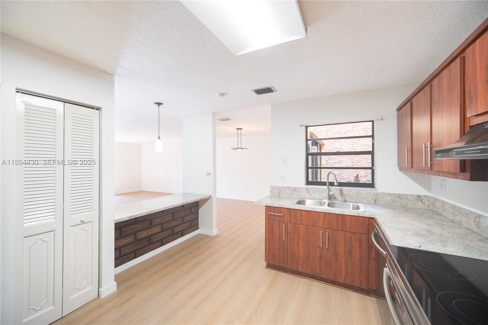 6845 Northwest 169th Street, Unit 41C Hialeah, FL 33015 - Photo 7 of 20 a bathroom with a tub sink and mirror