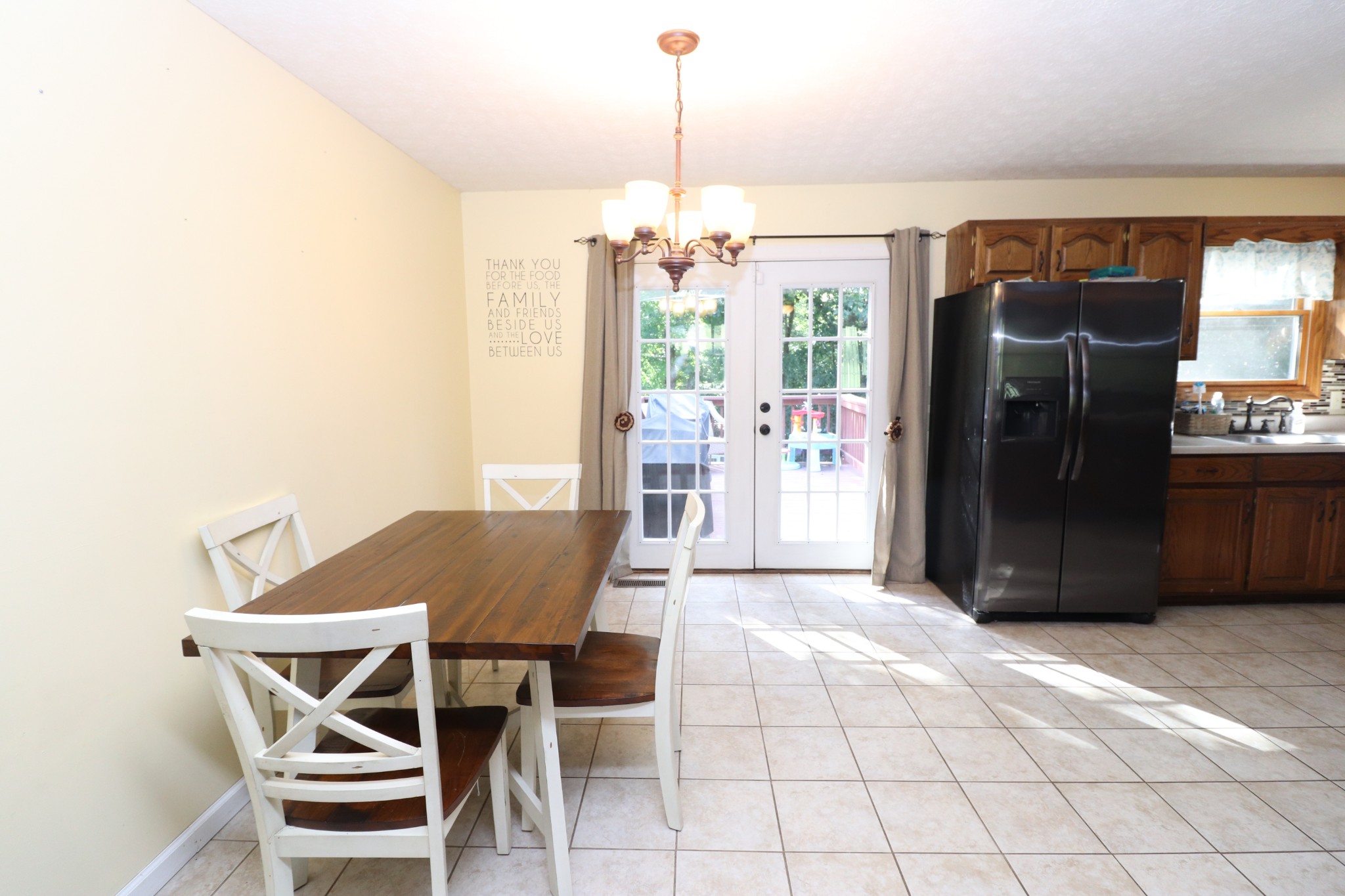 2724 Highland Road Lafayette, TN 37083 - Photo 8 of 39 a view of a dining room with furniture and a chandelier