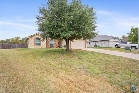a house view with a garden space