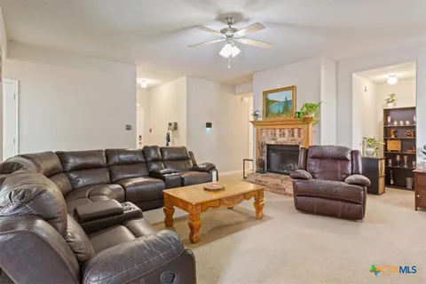 a kitchen with appliances cabinets and furniture