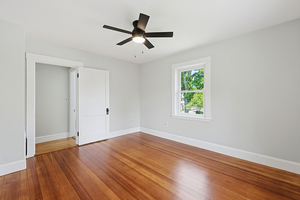 10 Water Street Natick, MA 01760 - Photo 18 of 35 a view of empty room with wooden floor and fan