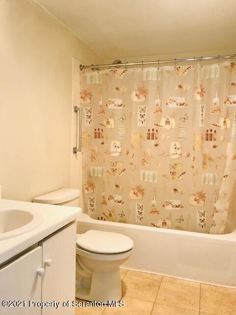 220 Linden Street, Unit 710 Scranton, PA 18503 - Photo 7 of 13 a bathroom with a toilet and a shower curtain
