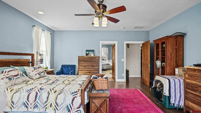 a bathroom with a bathtub sink and mirror