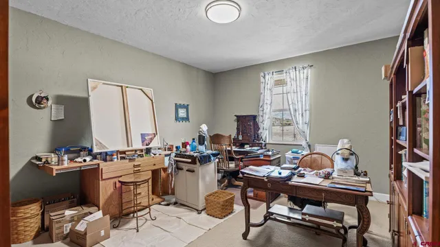 a bathroom with a granite countertop sink toilet a mirror and shower
