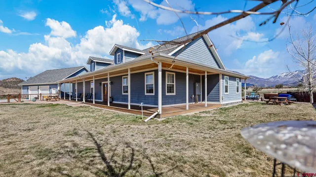 a view of multiple houses with a city view