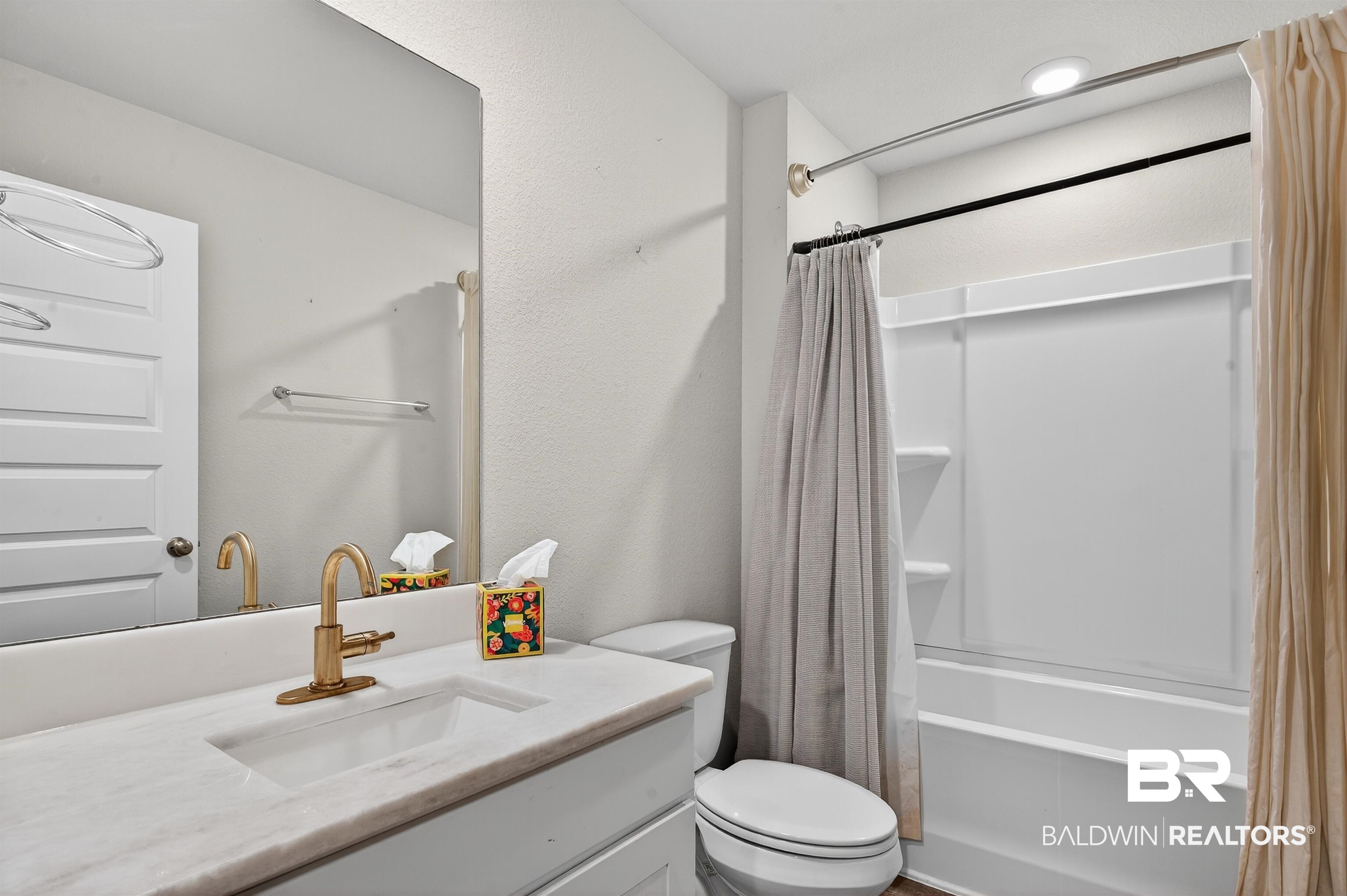 7429 Brompton Drive Foley, AL 36535 - Photo 37 of 50 Bathroom with shower / bathtub combination with curtain, vanity, and a textured wall